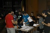 thumbnail of attendees receiving information handouts